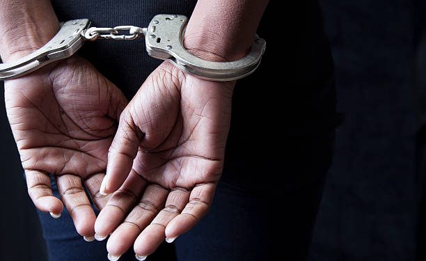 black woman in handcuffs